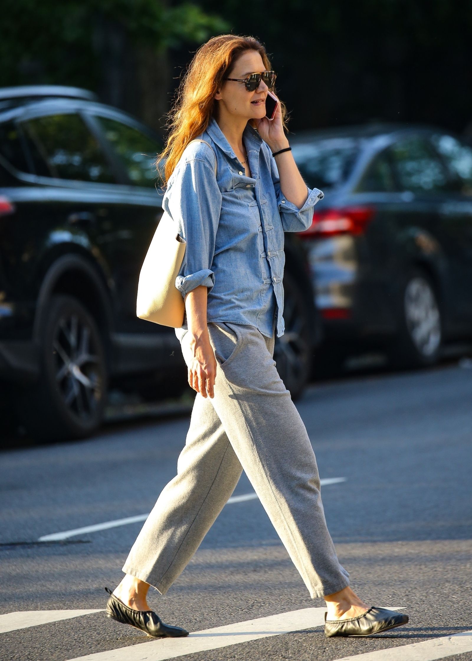 Image may contain Katie Holmes Clothing Pants Pedestrian Person Walking Footwear Shoe Accessories and Bracelet