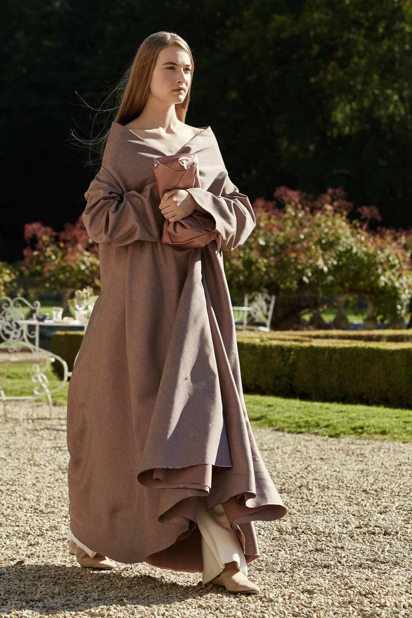 This image may contain Clothing Apparel Fashion Human Person Robe and Sleeve