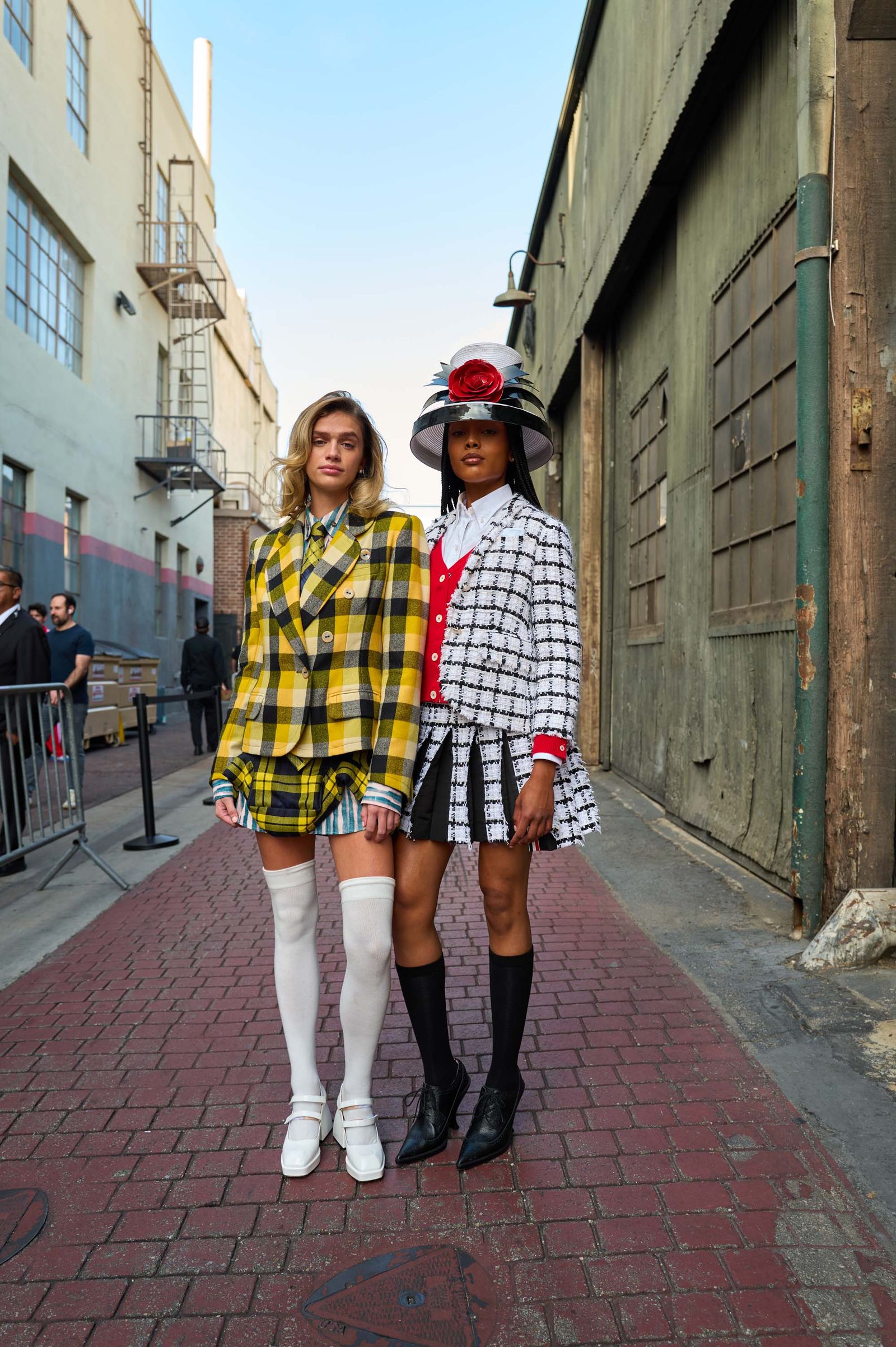 Hands wears fall 2025 Andreas Kronthaler for Vivienne Westwood Lanae is in fall 2024 Thom Browne and hat by Kokin.