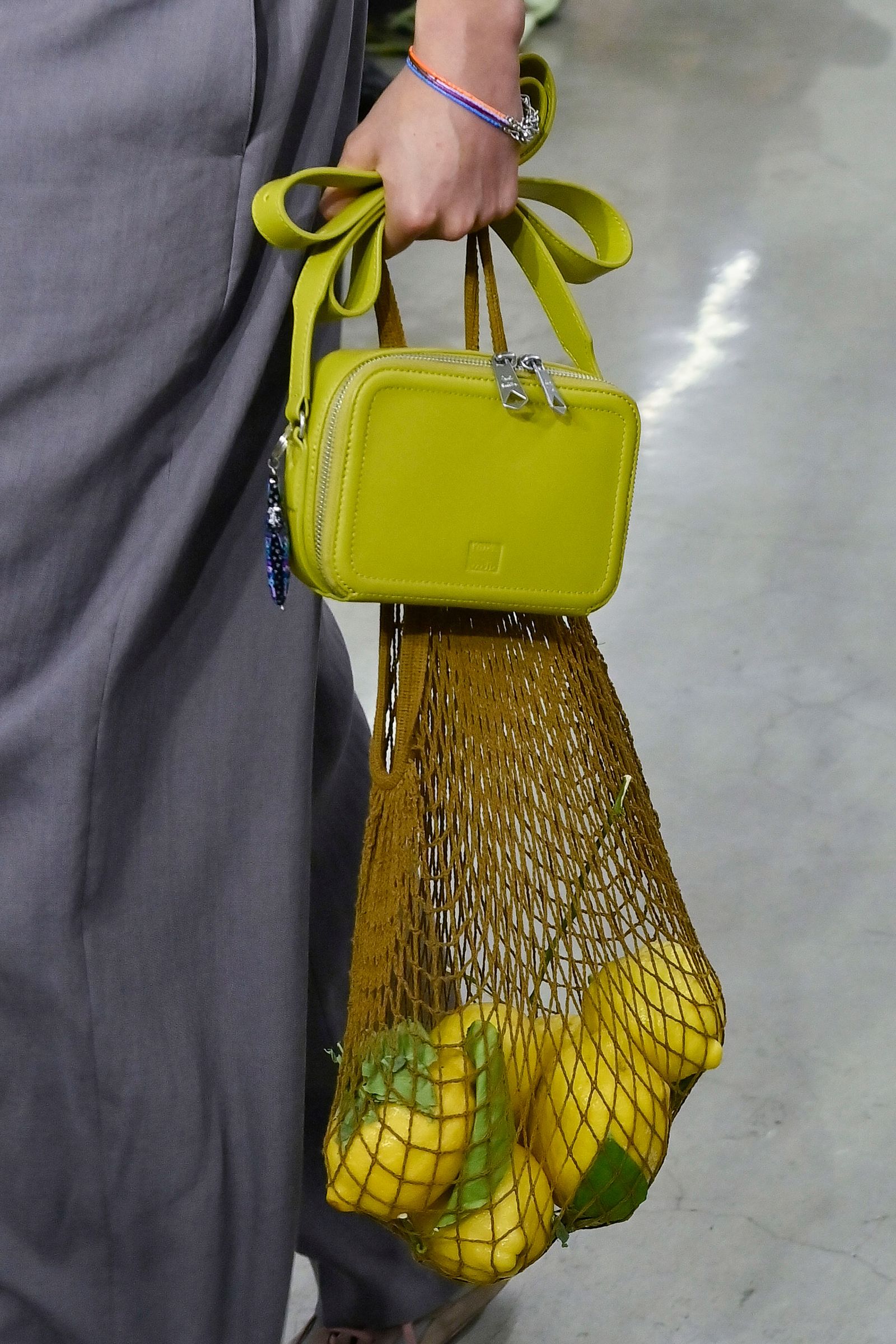 Image may contain Accessories Bag Handbag Citrus Fruit Food Fruit Plant Produce Purse Lemon Adult and Person