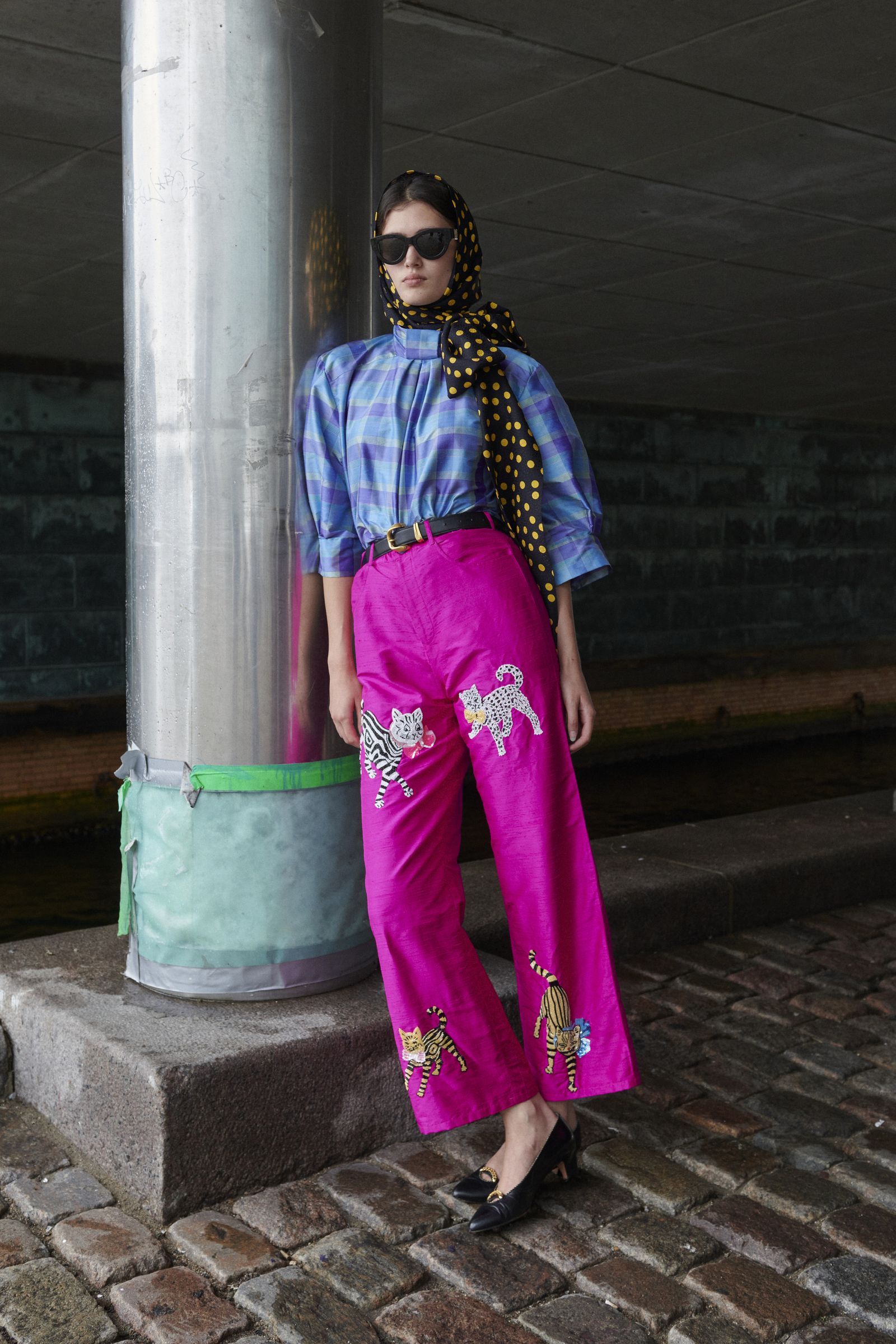 Image may contain Clothing Pants Adult Person Footwear High Heel Shoe Accessories Glasses Belt and Standing