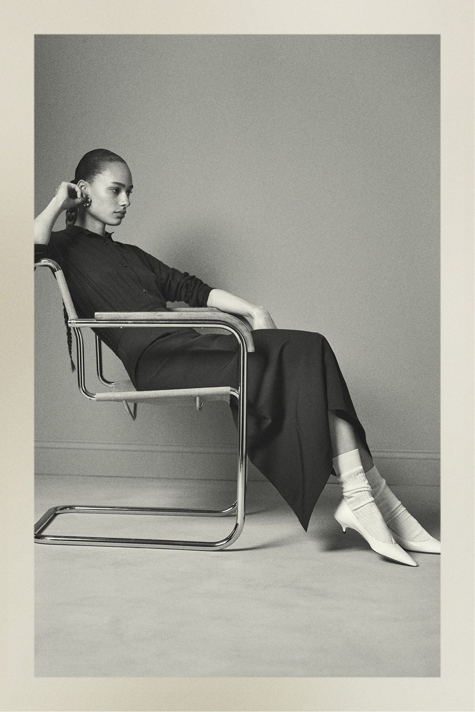 Image may contain Zoë Kravitz Person Sitting Clothing Footwear Shoe Adult Face Head Photography and Portrait