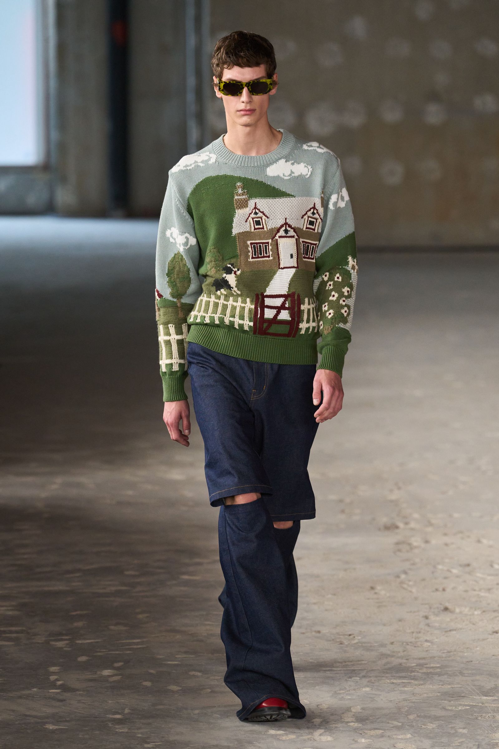 Image may contain Clothing Pants Person Teen Long Sleeve Sleeve Accessories Glasses Knitwear Sweater and TShirt