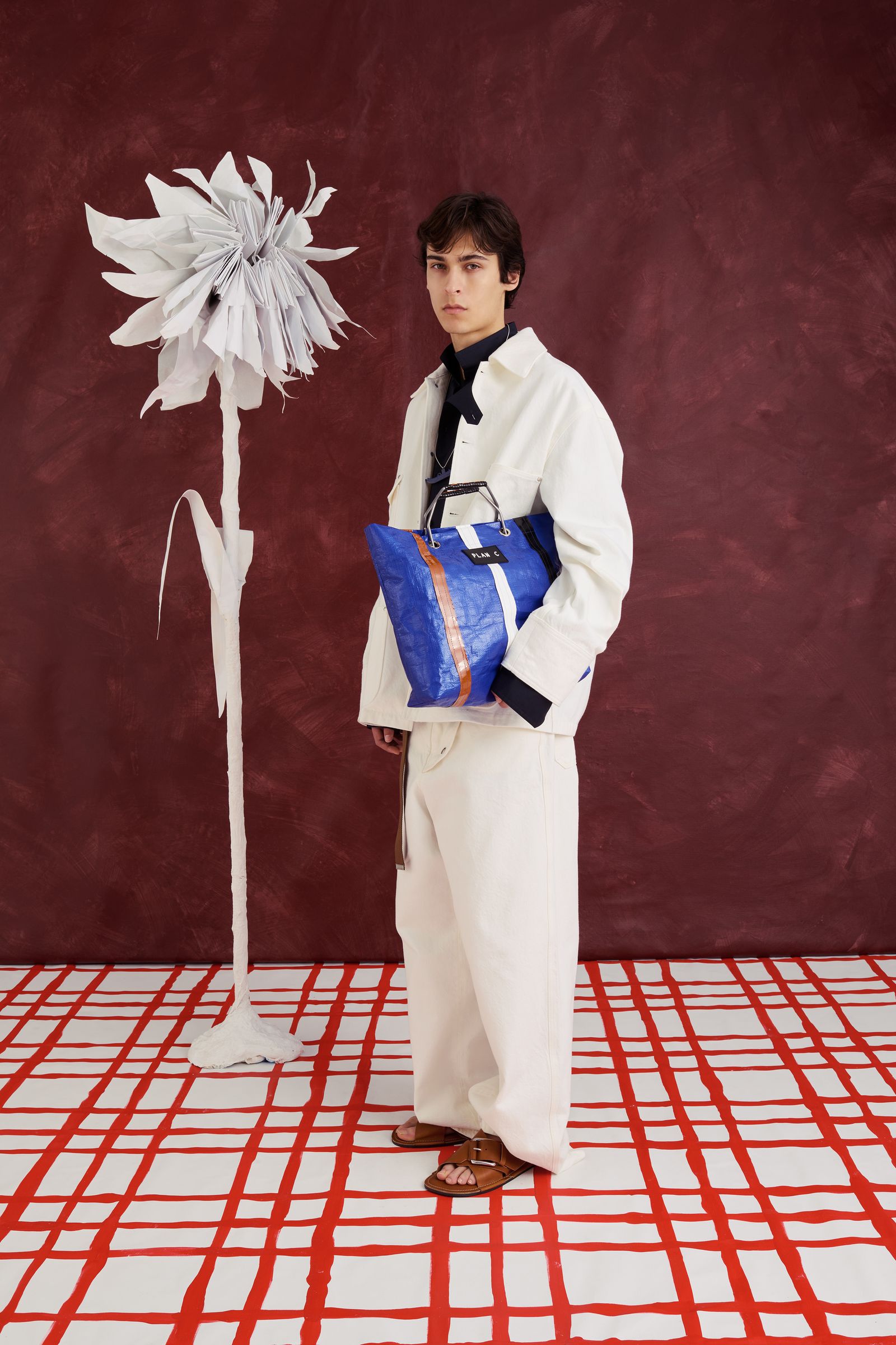 Image may contain Accessories Bag Handbag Child Person Clothing Footwear and Sandal