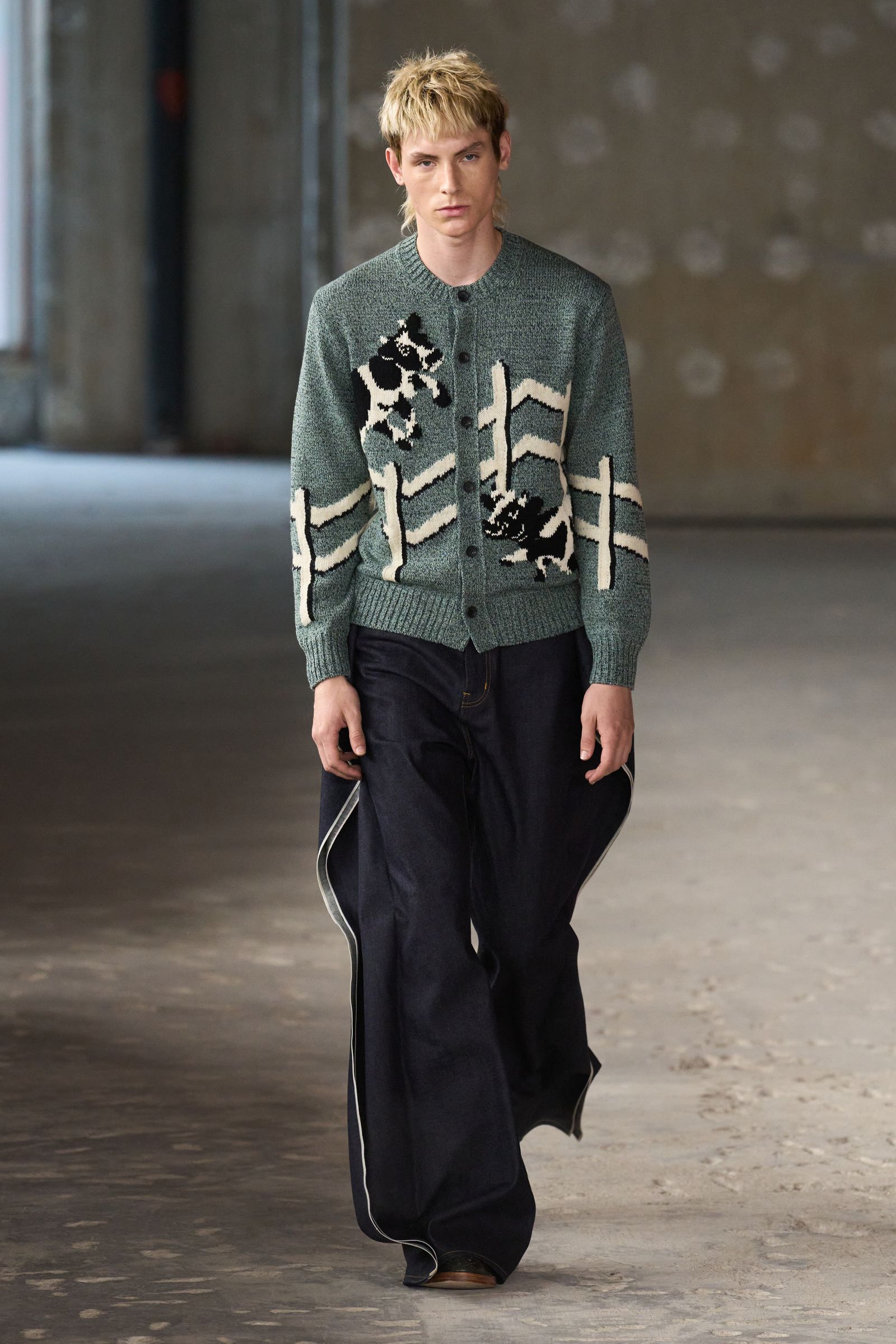 Image may contain Clothing Knitwear Sweater Pants Person and Teen