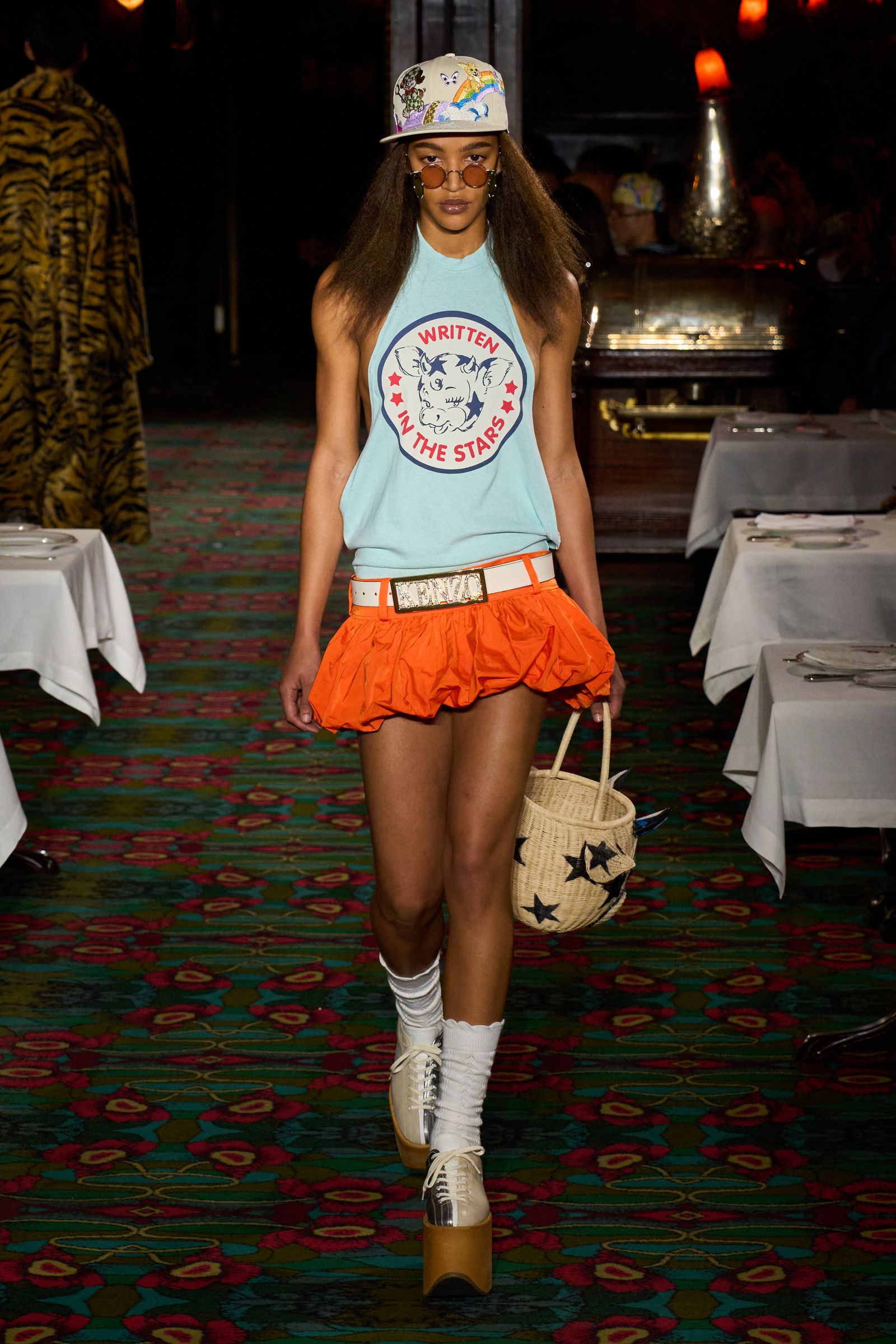 Image may contain Accessories Belt Clothing Skirt Shorts Person Hat Adult Bag Handbag Glasses Footwear and Shoe