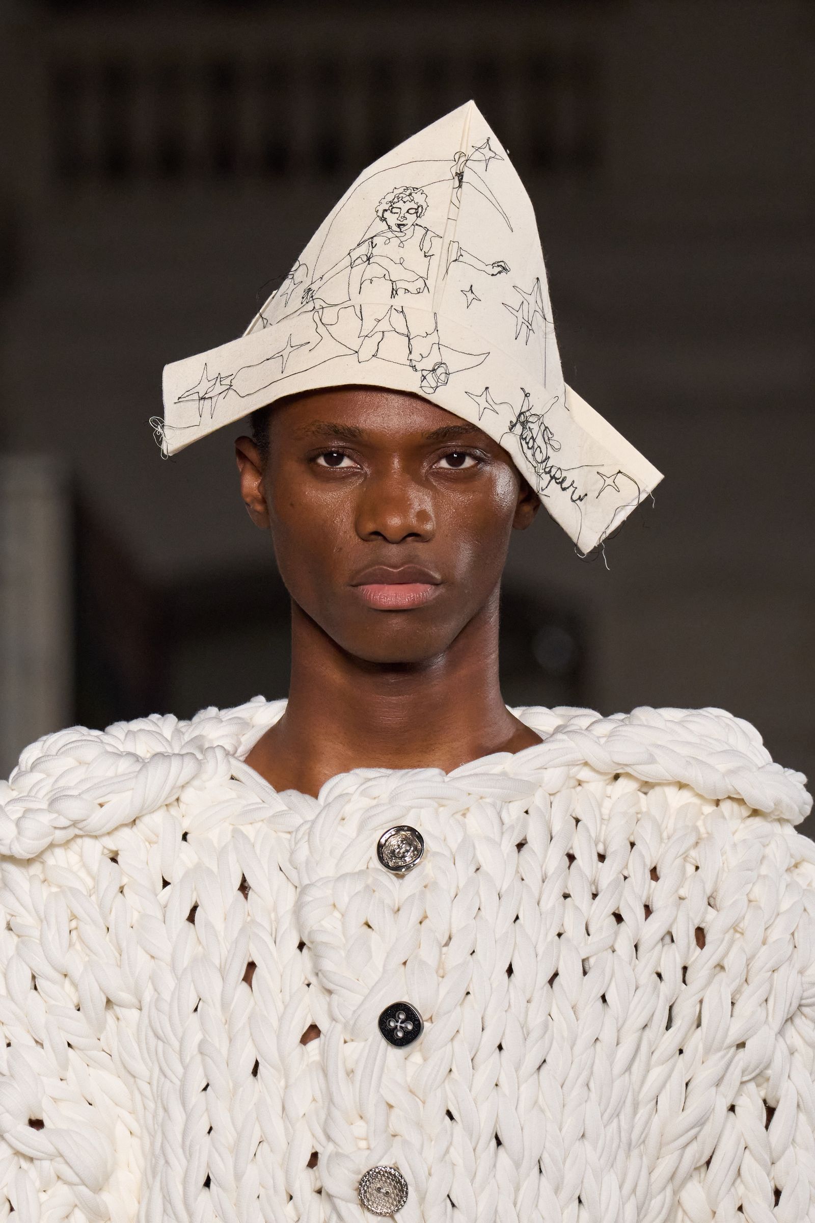 Image may contain Clothing Hat Face Head Person Adult Photography Portrait Cap and Wedding