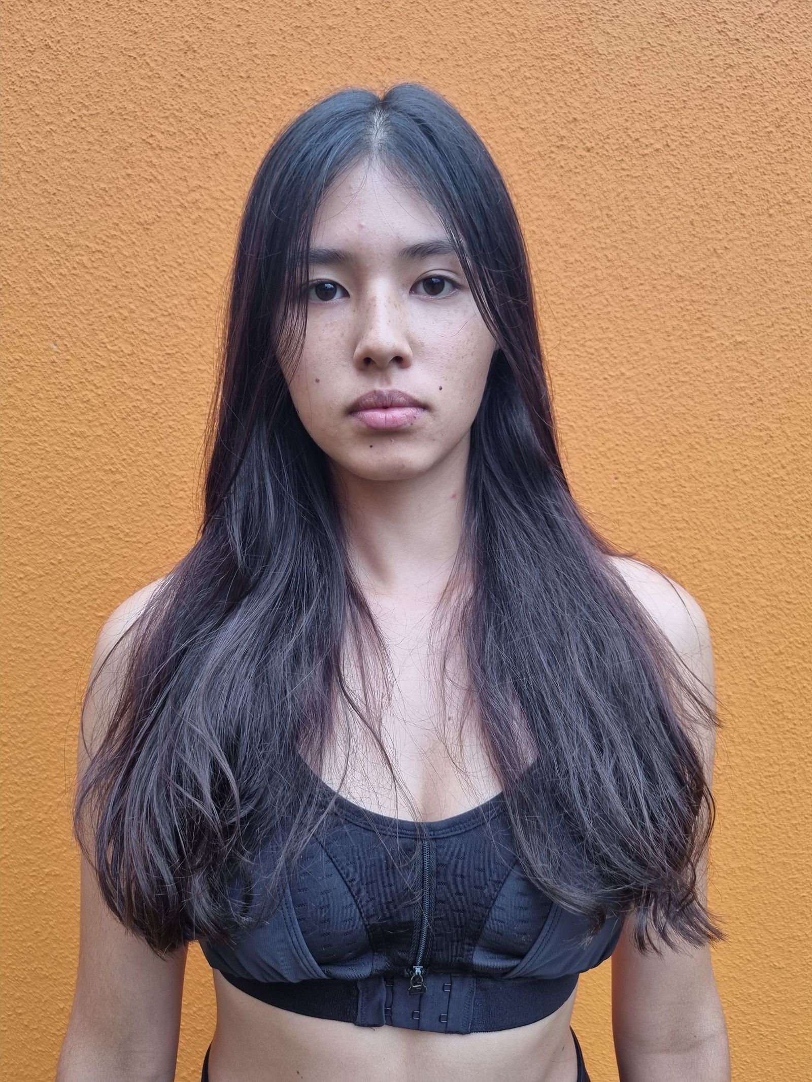 Image may contain Black Hair Hair Person Adult Face and Head