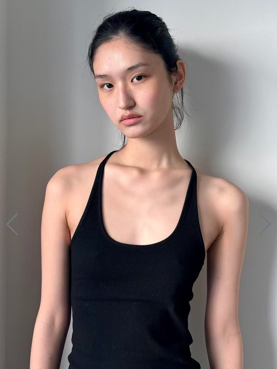 Image may contain Adult Person Head Face Body Part Neck Shoulder Clothing and Vest