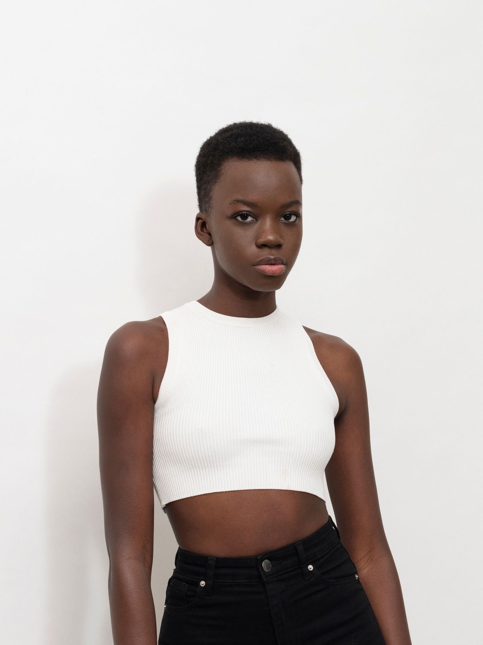 Image may contain Face Head Person Photography Portrait Body Part Neck Clothing Vest and Blouse