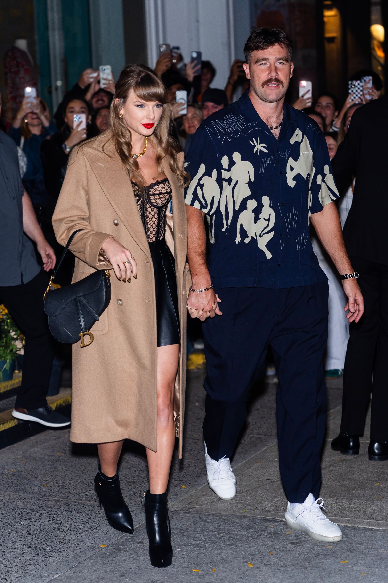 Image may contain Travis Kelce Taylor Swift Dola Banerjee Gale Brewer Clothing Footwear Shoe Accessories and Bag