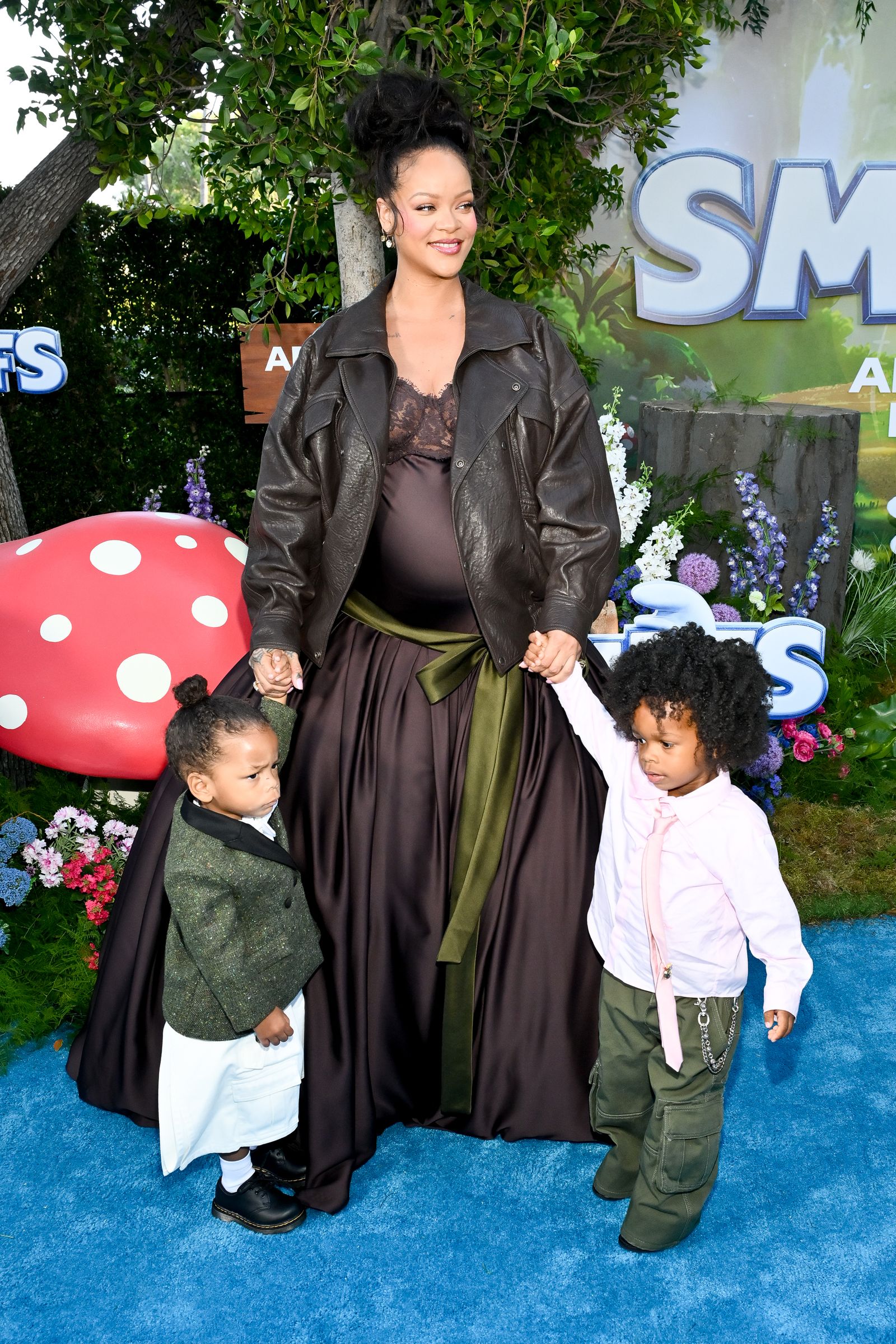 Image may contain Rihanna Clothing Coat Jacket Pants Face Head Person Photography Portrait Footwear and Shoe