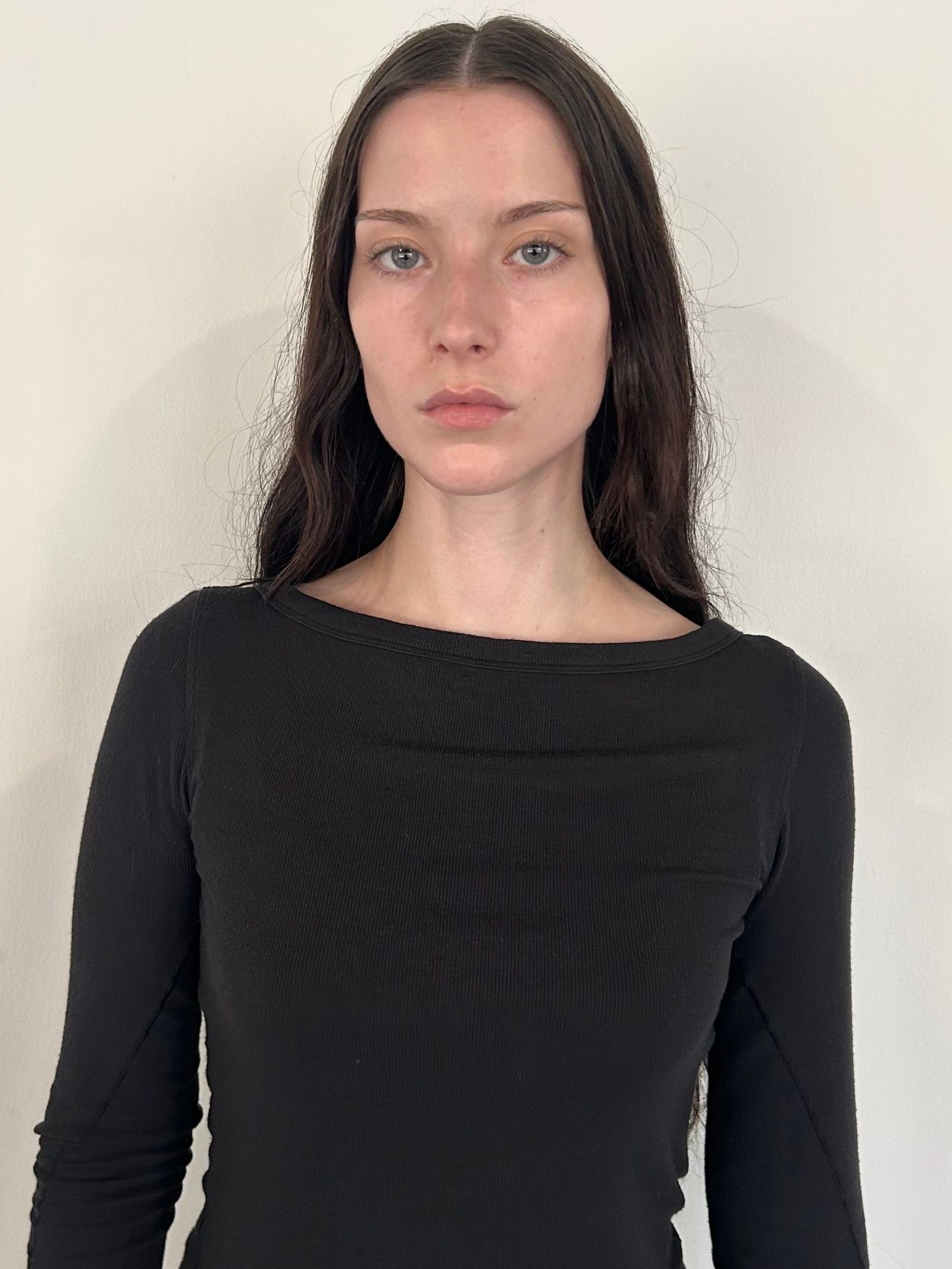 Image may contain Body Part Face Head Neck Person Photography Portrait Clothing Long Sleeve Sleeve and Adult